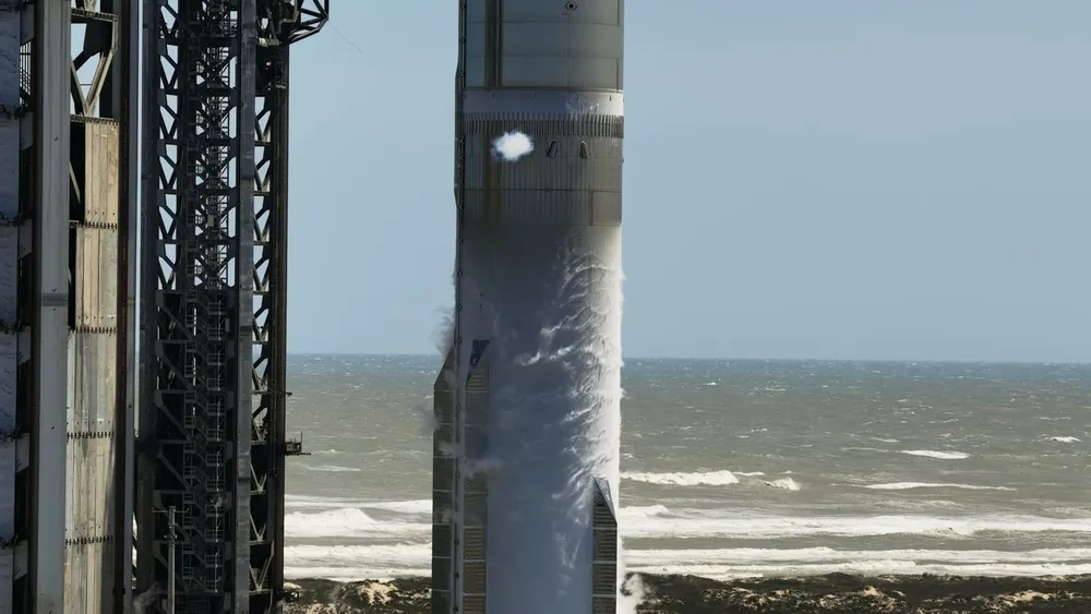 Starship hardware venting beside the launch tower on the Texas coast